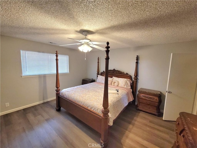 15420 Apache Rd, Apple Valley, CA 92307 - bedroom with wood finished floors, a ceiling fan, and a textured ceiling