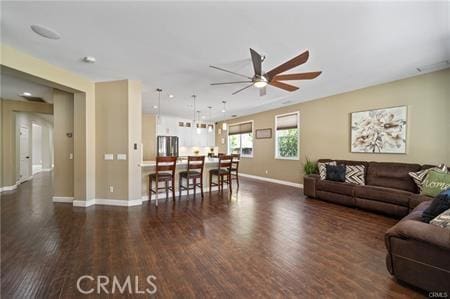 11126 Whitebark Ln, Corona, CA 92883 - living room with a ceiling fan and dark wood finished floors