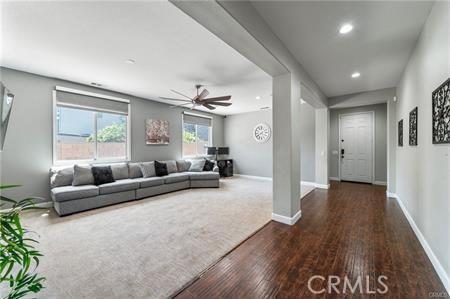 11126 Whitebark Ln, Corona, CA 92883 - living room with hardwood / wood-style flooring, a ceiling fan, and recessed lighting