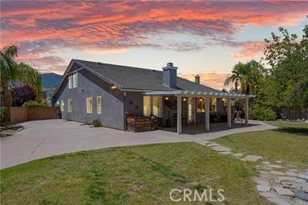 11126 Whitebark Ln, Corona, CA 92883 - rear view of property with a patio area and a chimney