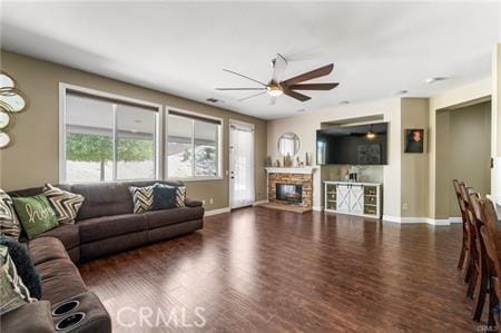 11126 Whitebark Ln, Corona, CA 92883 - living area with ceiling fan, wood finished floors, and a fireplace