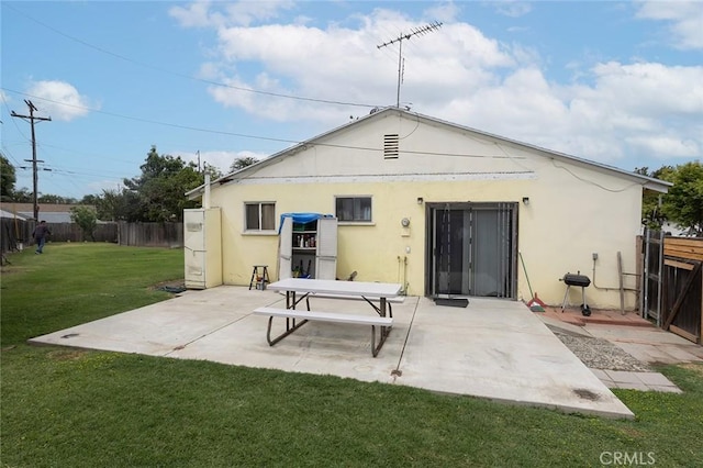 218 Muroc Pl, Fullerton, CA 92833 - back of property with a fenced backyard, a patio, and stucco siding