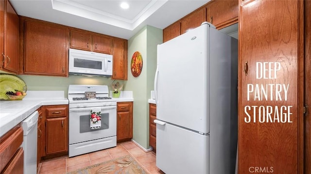 15927 Alta Vista Dr Unit D, La Mirada, CA 90638 - kitchen with white appliances, brown cabinets, tile counters, a raised ceiling, and recessed lighting