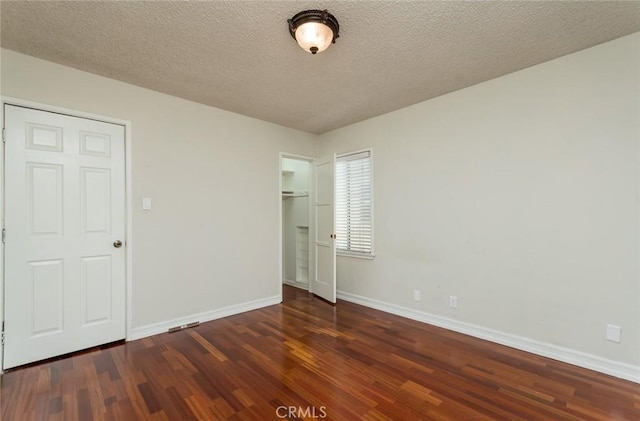 11162 Barman Ave, Culver City, CA 90230 - unfurnished bedroom with wood finished floors, a textured ceiling, and a closet