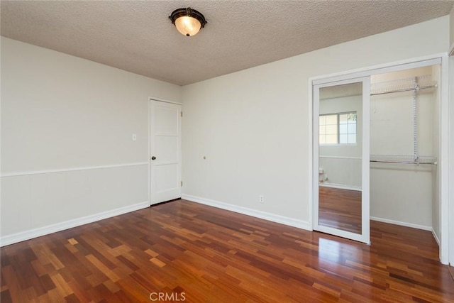 11162 Barman Ave, Culver City, CA 90230 - unfurnished bedroom featuring wood finished floors, a textured ceiling, and a closet