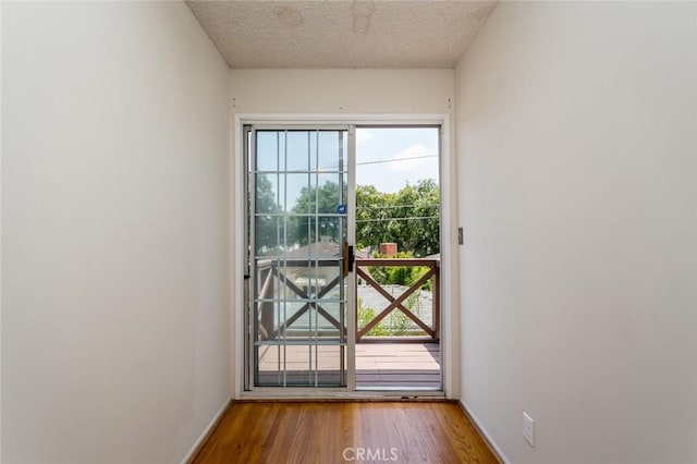 11162 Barman Ave, Culver City, CA 90230 - entryway featuring healthy amount of natural light, wood finished floors, and a textured ceiling
