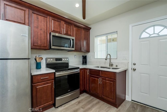 11162 Barman Ave, Culver City, CA 90230 - kitchen with stainless steel appliances, light wood finished floors, light countertops, tasteful backsplash, and recessed lighting