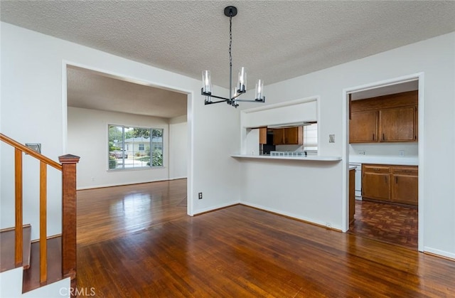 11162 Barman Ave, Culver City, CA 90230 - kitchen featuring a chandelier, light countertops, dark wood finished floors, pendant lighting, and a textured ceiling