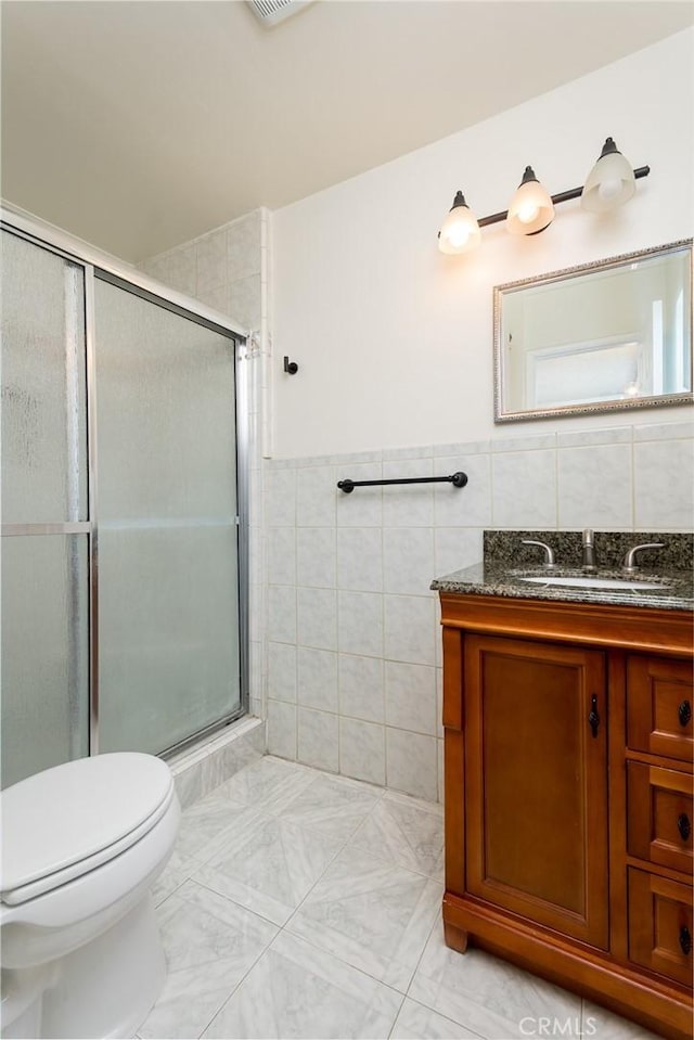 11162 Barman Ave, Culver City, CA 90230 - full bathroom featuring vanity, a shower stall, and tile walls