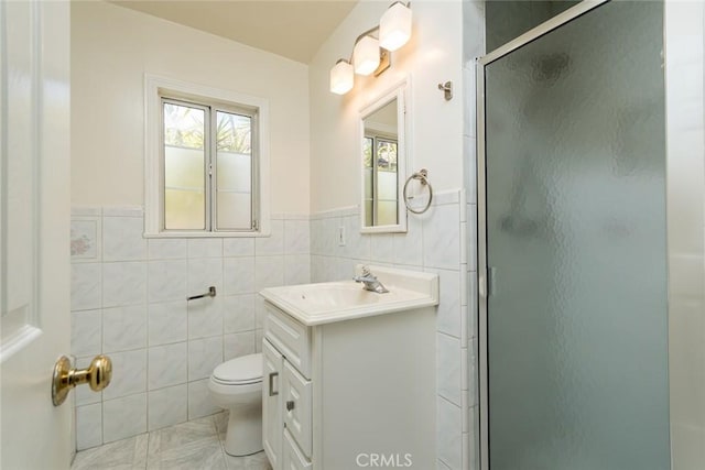 11162 Barman Ave, Culver City, CA 90230 - bathroom featuring tile walls, vanity, a shower stall, and wainscoting