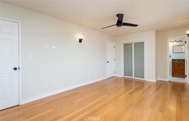 11162 Barman Ave, Culver City, CA 90230 - unfurnished bedroom with light wood finished floors, connected bathroom, a textured ceiling, and a ceiling fan