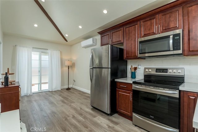 11162 Barman Ave, Culver City, CA 90230 - kitchen featuring appliances with stainless steel finishes, light countertops, lofted ceiling, decorative backsplash, and light wood finished floors