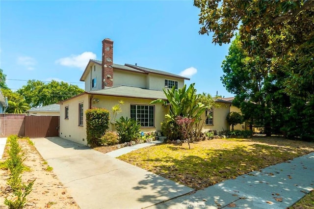 11162 Barman Ave, Culver City, CA 90230 - view of front of house featuring stucco siding, a chimney, and concrete driveway