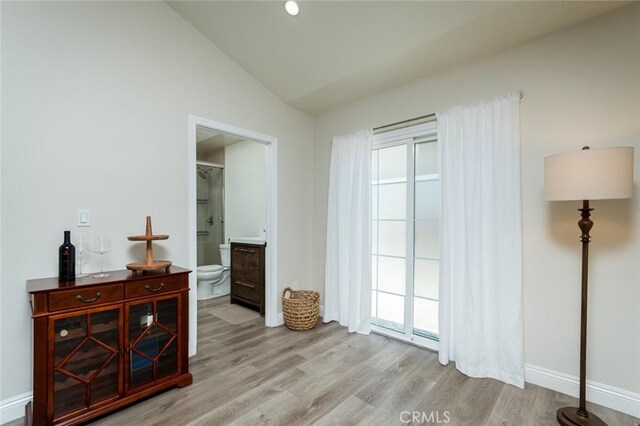 11162 Barman Ave, Culver City, CA 90230 - bedroom with vaulted ceiling, wood finished floors, and ensuite bathroom
