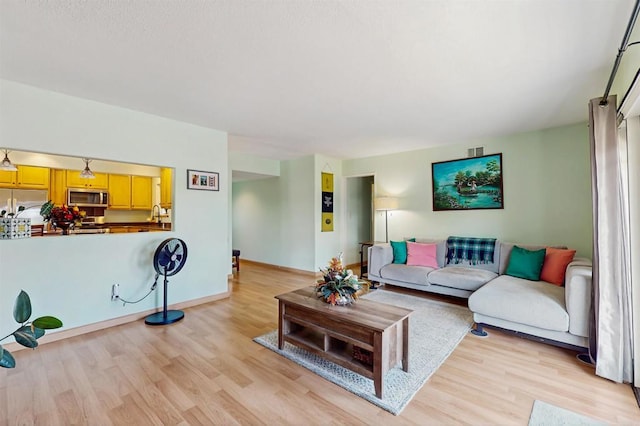 12538 Buckskin Trl, Poway, CA 92064 - living area featuring light wood-style floors and baseboards