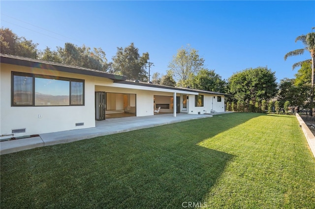 2115 E Santiago St, Covina, CA 91724 - rear view of property featuring a yard, a patio, and stucco siding