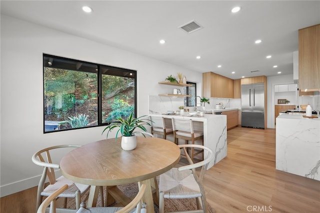 2115 E Santiago St, Covina, CA 91724 - dining area featuring light wood-type flooring and recessed lighting