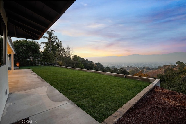2115 E Santiago St, Covina, CA 91724 - yard at dusk with a mountain view, a yard, and a patio