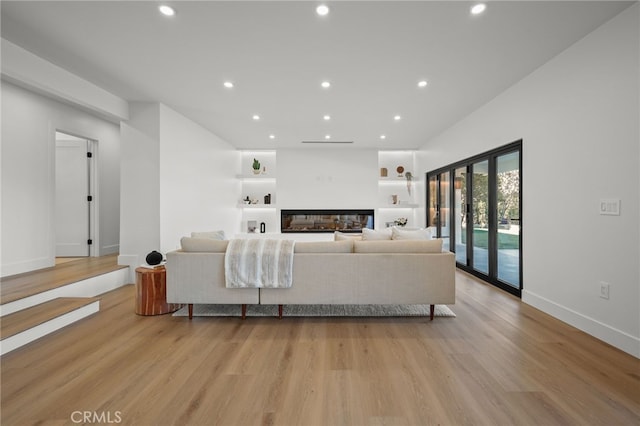 2115 E Santiago St, Covina, CA 91724 - living room with a glass covered fireplace, light wood-style flooring, and recessed lighting