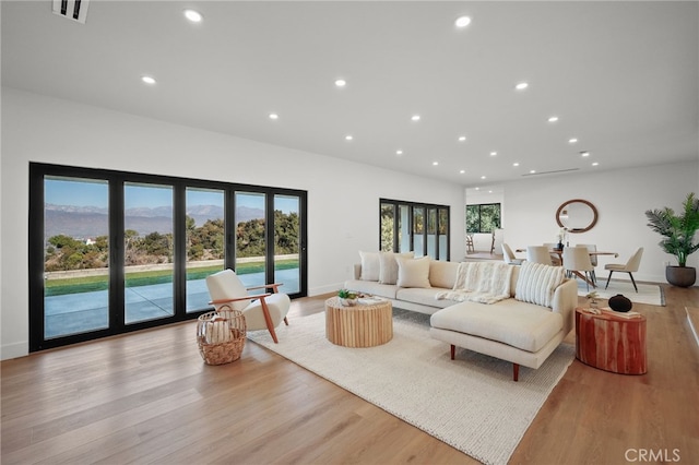 2115 E Santiago St, Covina, CA 91724 - living room with recessed lighting, plenty of natural light, wood finished floors, and a mountain view