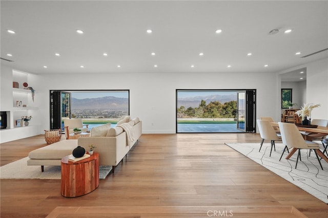 2115 E Santiago St, Covina, CA 91724 - living room with recessed lighting, light wood-style floors, and a mountain view