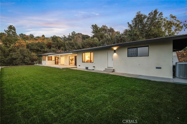 2115 E Santiago St, Covina, CA 91724 - rear view of house with a lawn, stucco siding, and a patio area