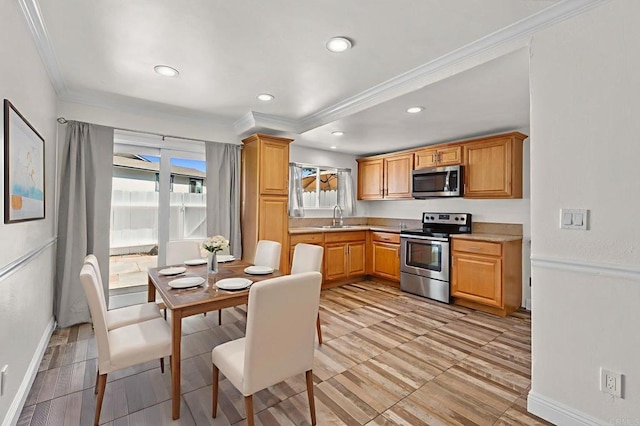3423 Del Este Way, Oceanside, CA 92056 - kitchen featuring appliances with stainless steel finishes, crown molding, light countertops, and recessed lighting