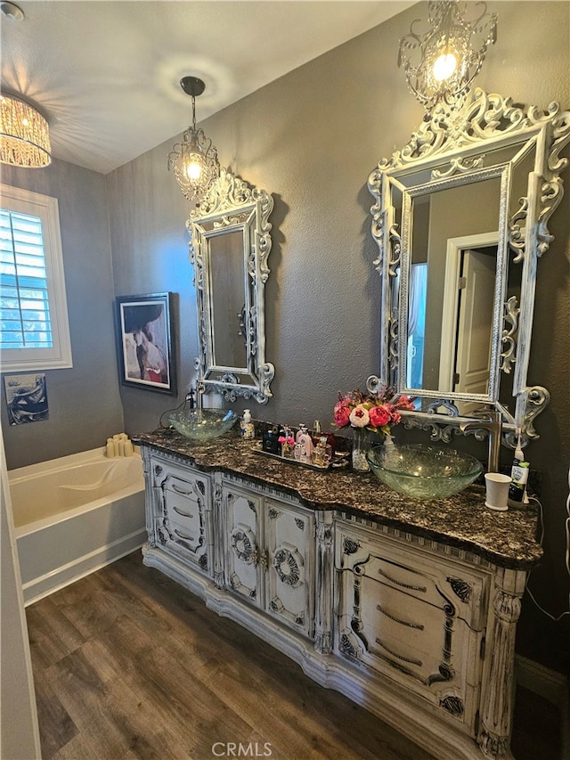 785 Harbor Cliff Way Unit 177, Oceanside, CA 92054 - full bathroom with wood finished floors, double vanity, a garden tub, and a chandelier