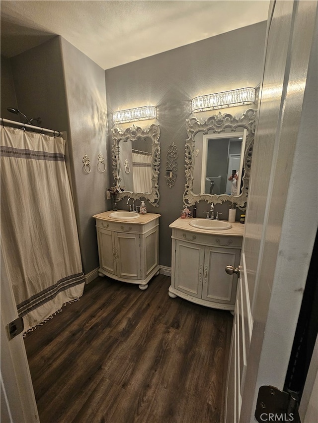 785 Harbor Cliff Way Unit 177, Oceanside, CA 92054 - bathroom with wood finished floors, two vanities, and curtained shower