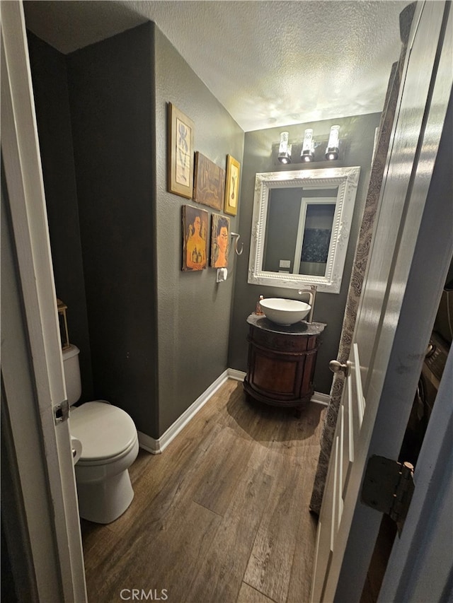 785 Harbor Cliff Way Unit 177, Oceanside, CA 92054 - bathroom featuring wood finished floors, a textured ceiling, and vanity