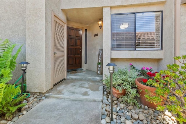 1346 Tourney Hill Ln Unit 67, Nipomo, CA 93444 - doorway to property featuring stucco siding
