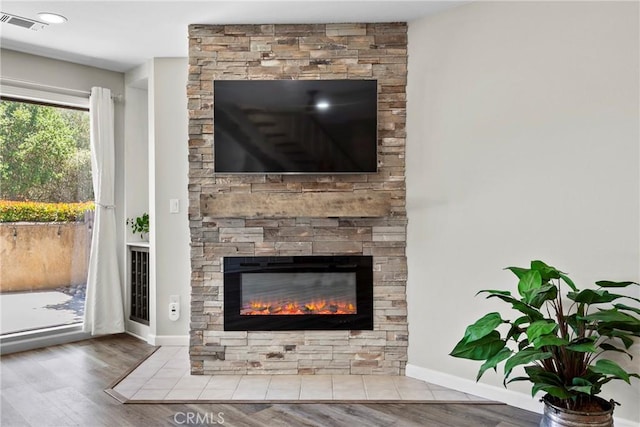 1346 Tourney Hill Ln Unit 67, Nipomo, CA 93444 - detailed view of wood finished floors and a stone fireplace