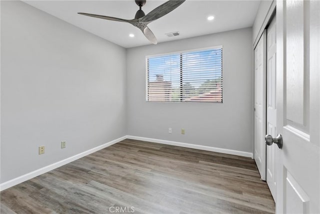 1346 Tourney Hill Ln Unit 67, Nipomo, CA 93444 - unfurnished bedroom featuring wood finished floors, recessed lighting, a closet, and ceiling fan