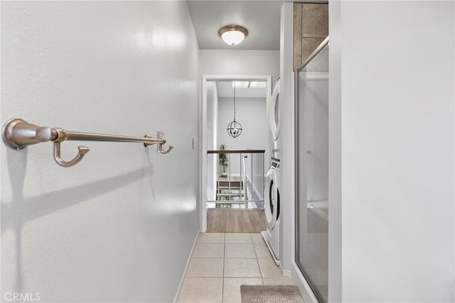 1346 Tourney Hill Ln Unit 67, Nipomo, CA 93444 - hall featuring estacked washer and dryer and light tile patterned floors