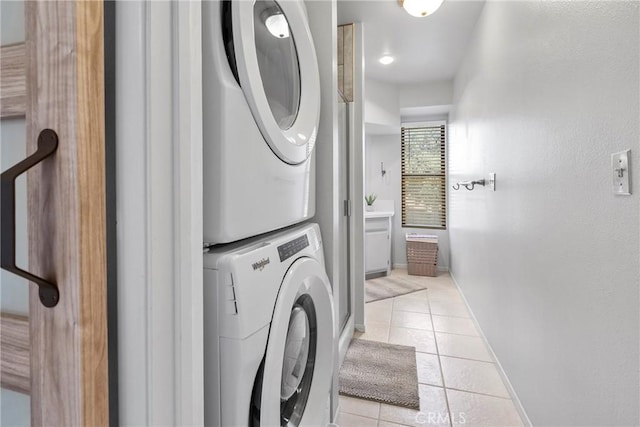1346 Tourney Hill Ln Unit 67, Nipomo, CA 93444 - laundry area featuring stacked washer / dryer and light tile patterned floors