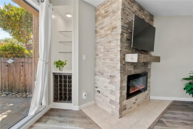 1346 Tourney Hill Ln Unit 67, Nipomo, CA 93444 - unfurnished living room with a fireplace and wood finished floors