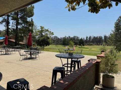 1346 Tourney Hill Ln Unit 67, Nipomo, CA 93444 - view of patio featuring outdoor dining area and view of scattered trees