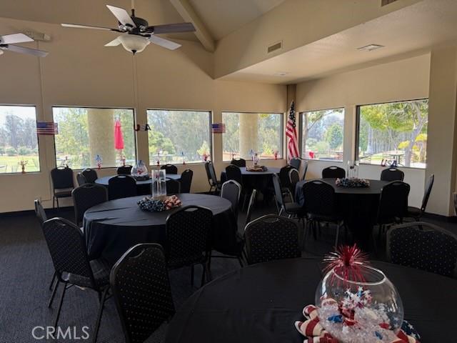1346 Tourney Hill Ln Unit 67, Nipomo, CA 93444 - carpeted dining space featuring a ceiling fan, high vaulted ceiling, and beam ceiling