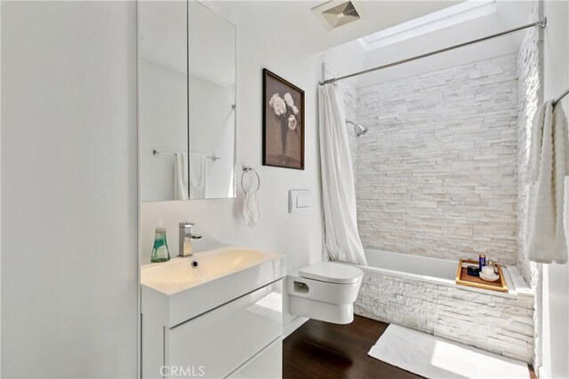 2704 Voorhees Ave Unit 4, Redondo Beach, CA 90278 - bathroom with tiled shower / bath, vanity, and wood finished floors