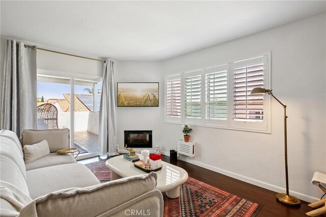 2704 Voorhees Ave Unit 4, Redondo Beach, CA 90278 - living area with plenty of natural light, wood finished floors, and a glass covered fireplace