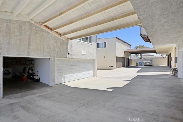 2704 Voorhees Ave Unit 4, Redondo Beach, CA 90278 - garage with washer / dryer and driveway