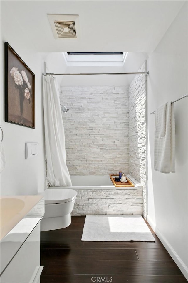 2704 Voorhees Ave Unit 4, Redondo Beach, CA 90278 - bathroom featuring vanity, wood finished floors, and tiled shower / bath combo