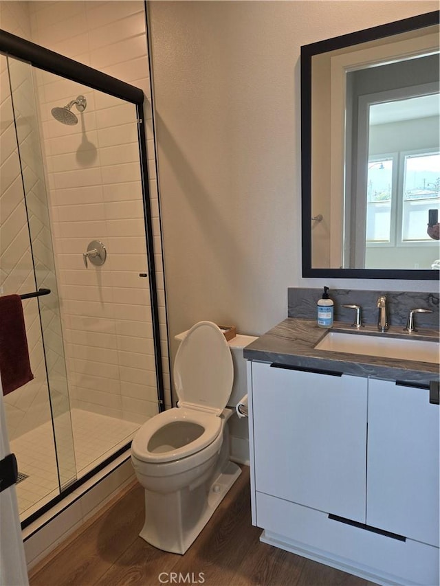 171 Bear Leaf Dr, Lake Forest, CA 92630 - bathroom featuring wood finished floors, a stall shower, vanity, and baseboard heating