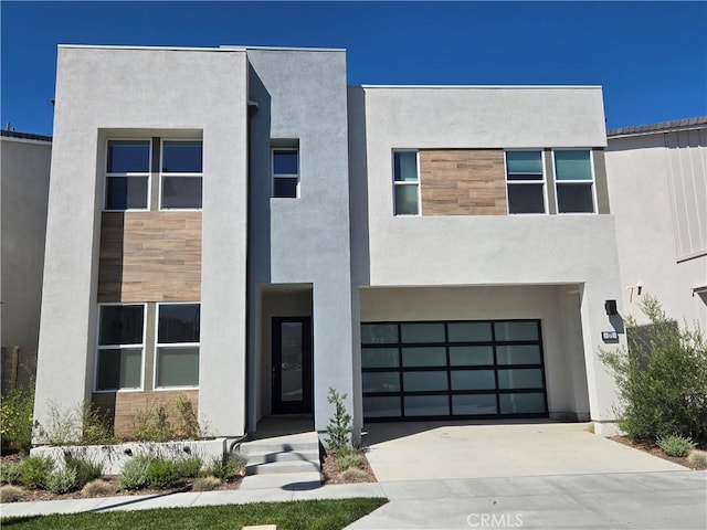 171 Bear Leaf Dr, Lake Forest, CA 92630 - view of front of property with concrete driveway, stucco siding, and a garage