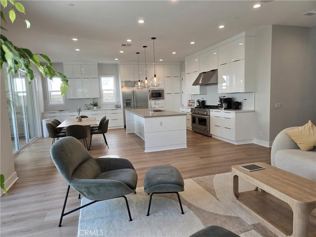 171 Bear Leaf Dr, Lake Forest, CA 92630 - living room featuring recessed lighting and light wood-style flooring