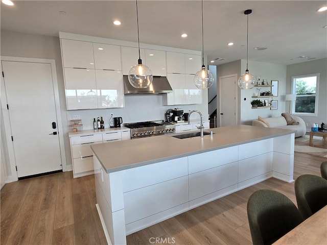 171 Bear Leaf Dr, Lake Forest, CA 92630 - kitchen featuring exhaust hood, modern cabinets, white cabinetry, light wood-type flooring, and recessed lighting