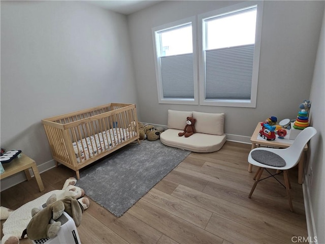 171 Bear Leaf Dr, Lake Forest, CA 92630 - bedroom featuring a nursery area and wood finished floors