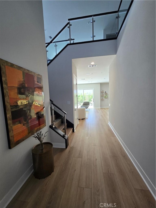 171 Bear Leaf Dr, Lake Forest, CA 92630 - hallway with wood finished floors and stairway
