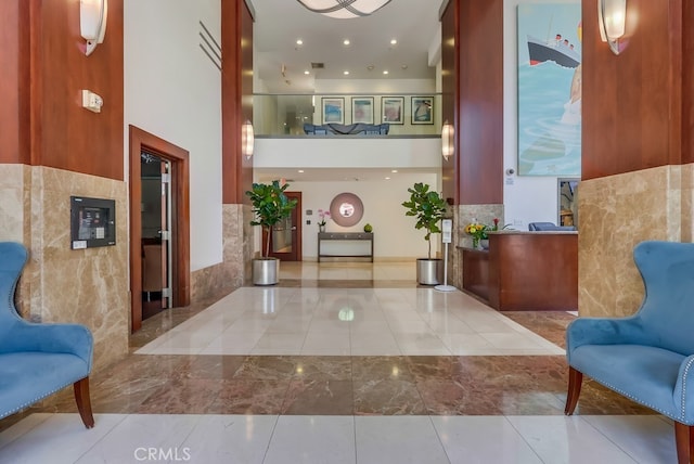 488 E Ocean Blvd Unit 502, Long Beach, CA 90802 - lobby featuring tile walls, a high ceiling, and recessed lighting