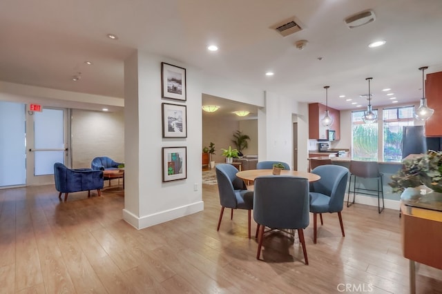 488 E Ocean Blvd Unit 502, Long Beach, CA 90802 - dining area featuring light wood finished floors and recessed lighting